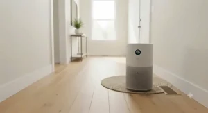 An air purifier operating in a hallway with new engineered hardwood flooring to help eliminate formaldehyde and VOC off-gassing.